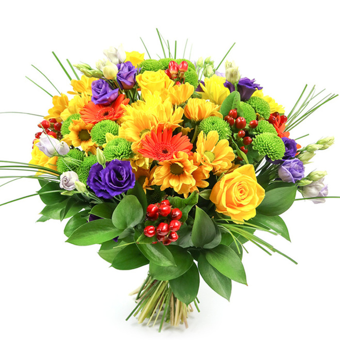 A lavish, hand-tied bouquet is photographed against a seamless white background, allowing its joyful fusion of colours to take on a sculptural presence. The arrangement forms a generous, rounded dome, densely packed with fresh flowers that look as if they have just been gathered from a well-loved garden tucked behind a Clerkenwell townhouse. Dominating the composition are luminous yellow blooms: classic yellow roses with neatly spiralled centres and full yellow chrysanthemums with layered petals that create a cushion-like softness. Interlaced with these are fiery orange gerbera daisies and smaller orange, daisy-style flowers, their open faces and strong stems injecting a burst of sunshine that feels especially fitting for celebrations in and around St John's Square. To temper and enrich the warmth, deep purple lisianthus blooms are threaded throughout, their ruffled petals and elegant trumpet shapes adding sophistication and a gentle sense of depth. Vibrant lime-green button chrysanthemums appear like tiny orbs of colour, their smooth, rounded forms providing playful contrast to the broader petals around them. Nestled between petals and leaves, clusters of shiny ruby-red hypericum berries create little pockets of texture and a quietly festive feeling. Fine green grasses rise and curve from the bouquet, introducing lift and movement above a robust base of dark, glossy foliage that cradles the entire design. The neatly tied stems at the bottom highlight the care and precision of a skilled local florist, suggesting a bouquet ready for same-day delivery to a Clerkenwell studio, office, or home, perfect for birthdays, thank-you gifts, or simply bringing a bit of bright, seasonal joy indoors.