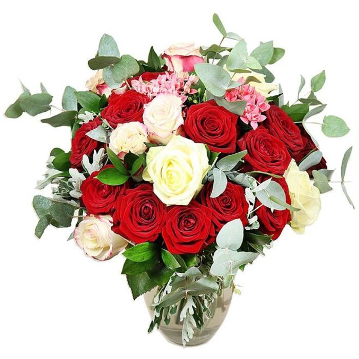 A richly detailed image presents an opulent rose bouquet set against a pure white background, as if displayed on a sunlit counter in a Clerkenwell flower studio. The flowers emerge from a clear glass vase with a rounded, slightly bulbous base that tapers gracefully to a narrower neck, the submerged stems visible and neatly aligned in clear water. Above the vase, the arrangement swells into a full, domed shape, brimming with roses layered so closely that the bouquet seems almost cloud-like in its density. Deep red and intense scarlet roses dominate the composition, some just beginning to unfurl while others are fully open, revealing velvety, spiralled petals that suggest deep romance and timeless passion. Threaded carefully among these warmer tones are white and creamy ivory roses, their softer hues catching the light and offering a calming balance, with a few blooms subtly edged in pale pink to introduce a delicate blush of tenderness. Bright pink filler flowers, perhaps miniature carnations or similar small blooms, dance between the roses, their clustered heads adding pockets of texture and a lively, playful touch of colour. Encircling the flowers, stems of blue-green eucalyptus with their distinctive rounded, slightly dusty leaves create a cool, contemporary halo, hinting at an aromatic freshness that contrasts with the richness of the roses. Deeper green foliage and some silvery-green leaves fill out the base and inner spaces, adding depth, structure, and a natural, garden-like feel. The sharp white background isolates the bouquet completely, allowing every tone of red, white, and pink, and each flick of foliage, to stand out. It feels like a luxurious gift ready for same-day delivery in Clerkenwell, perfect for anniversaries, special dinners near Farringdon, or any heartfelt romantic gesture.