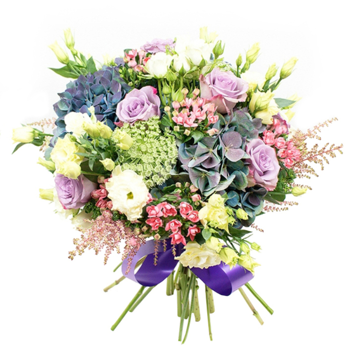 Overflowing with character and refined visual harmony, this bouquet crafted for Clerkenwell captures the modern elegance of local floral artistry. At its core, broad, pillowy hydrangeas span indigo, teal, and muted purple, each bloom full and velvety, reminiscent of the evening shadows along the historic lanes near Leather Lane Market. Nestled among these, lavender and creamy white roses reveal inviting layers of petals, their gentle hues blending seamlessly with the classic architecture of Clerkenwell's townhouses. White ranunculus blossoms introduce soft, densely ruffled textures, creating tactile intrigue, while slender stems of pale yellow eustoma weave upwards, their graceful buds infusing just the right amount of brightness to the mix. Bright fuchsia fillers ripple through, catching the eye with vibrant energy, as feathery astilbe in whisper-light pink traces a whimsical outline at the bouquet's fringes. Wispy, lacy filler flowers in sheer greens and whites, akin to Ammi Majus, provide frothy depth and hint at Clerkenwell's green corners and community gardens. Dark, shining leaves anchor the composition, acting as a verdant background and sharpening the bouquet's invigorating palette. Expertly bound at the base with a lavish royal purple satin ribbon, the arrangement shines with professional care and a touch of London luxury. This bouquet radiates warmth and celebration, making it an exquisite choice for birthdays, anniversaries, or to bring joy to a home near Exmouth Market or Rosebery Avenue, beautifully embodying the artistry and vibrant flair of Clerkenwell's florists.