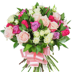 In this lush, hand-tied rose bouquet presented on a brilliant white background, every element is composed to feel both luxurious and approachable. Large, fully opened roses in soft blush pink and creamy ivory dominate the scene, their layered petals showing delicate veining and a satiny sheen; interspersed are vivid fuchsia roses that introduce a lively pop of magenta-pink, and a few pale lavender roses that cool the palette with their gentle lilac tones. Scattered throughout are clusters of small spray roses, predominantly creamy with touches of pale yellow, which create charming pockets of texture and intimate detail among the larger blossoms. Deep green glossy foliage - likely ruscus or salal - slips between blooms, its clean edges and sheen framing each rose and enhancing the bouquet's three-dimensional fullness. The stems below are tightly bound and finished with a wide, soft pink satin ribbon tied in a large, elegant bow whose loops catch the studio light. There is an airy, faint rosy perfume to the arrangement, layered with a crisp green scent that evokes morning walks by St John's Square and the fresh produce stalls of Exmouth Market. Crafted by a local hand, the composition balances celebration and tenderness, ideal for birthdays, anniversaries, or a thoughtful Mother's Day gesture; this is a bouquet Clerkenwell Flowers would offer to convey warmth and appreciation across Farringdon and nearby streets.