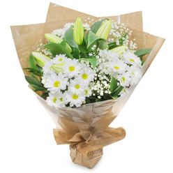 A refined bouquet photographed upright on a plain white field, its palette of crisp whites and deep greens evoking the calm of early morning in Clerkenwell. The focal point is a dense spray of bright white chrysanthemums, their many narrow petals radiating from small yellow centres that lend a quietly cheerful rhythm across the arrangement. Interwoven are slim, pale green-yellow lily buds, some subtly striped and tucked among the chrysanthemums as a promise of future bloom-an elegant counterpoint that brings graceful height and anticipation to the design. Delicate clusters of baby's breath (Gypsophila) drift between the larger flowers like wisps of cloud, softening edges and adding a fine-textured, romantic veil.

Lush, dark green foliage provides contrast and depth, its glossy leaves a grounding backdrop that amplifies the whites' clarity. The bouquet is hand-tied, wrapped with an inner sheet of rustic crinkled brown kraft paper and an outer layer of clear cellophane that shimmers slightly, protecting the stems and keeping the composition neat for carrying. The gathered base is secured in a tidy knot, creating a portable, stable presentation typical of market-style hand-ties from local shops around Farringdon and Leather Lane.

Scent is subtle and fresh-clean floral notes with a green, dewy undertone-suitable for a birthday, a thoughtful thank-you, or a calming sympathy arrangement. Available for local delivery across Clerkenwell and nearby Farringdon, this bouquet reads as both classic and quietly modern, handcrafted with the careful proportions and tactile textures a neighbourhood florist would use for intimate, versatile gifting.