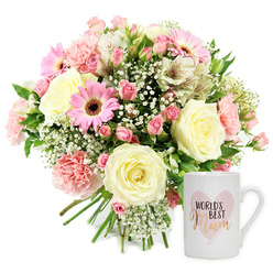 Set against a crisp white background, this photograph captures a thoughtful floral gift set that radiates affection, the kind you might send to a much-loved mum living near Exmouth Market or St John Street in Clerkenwell. On the left, a generously rounded bouquet overflows with soft, welcoming tones of pink, cream, and white, all gently framed by fresh greenery. At its heart sit several large cream roses, fully opened so that their spiralled centres and smooth outer petals create a sense of calm elegance. Nestled between them, blush pink carnations with finely ruffled edges introduce a playful, tactile texture, each bloom layered like folded fabric. Bright pink gerbera daisies punctuate the arrangement, their bold discs and dark brown centres adding lively contrast and a sense of joy, like a burst of laughter in a family kitchen. Slender white alstroemeria stems weave through the bouquet, their trumpet-shaped flowers delicately flecked with reddish-brown markings that hint at their exotic origin while still feeling soft and familiar. Airy sprigs of white baby's breath float throughout the design, creating a misty veil that binds the different blooms together and gives the bouquet a romantic, almost dreamlike quality. Fresh green leaves peek from beneath and between the flowers, grounding the pastel palette and evoking the calm of nearby Spa Fields on a spring morning. The stems at the base are neatly aligned, showcasing a professional hand-tied finish often associated with skilled local florists. To the right stands a smooth, white ceramic mug, its surface bright and reflective under the studio lights. A watercolour pink heart decorates the front, within which the phrase "WORLD'S BEST" appears in simple black capitals above the word "Mum," written in a flowing, metallic gold or rose-gold script that catches the eye. Together, the bouquet and mug form a tender visual message of thanks and appreciation, ideal for same-day delivery across Clerkenwell to mark Mother's Day, a special birthday, or any moment when you want to say, "You're treasured."