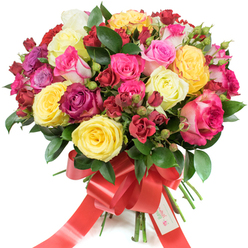 A vibrant, full-bodied bouquet of hand-tied roses displayed against a crisp white backdrop, crafted to suggest generosity and refined joy. The rounded composition is densely packed: large hybrid tea roses unfurl in full bloom alongside smaller spray roses and a selection of tight, hopeful buds that give the arrangement lively movement. The palette is intentionally bright and varied-cheerful yellow roses, creamy ivory tones, a range of pinks from pale blush to electric fuchsia and some delicate pink-and-white bi-colours, plus deeper burgundy and cherry-red blooms that bring a romantic counterpoint. Interspersed glossy foliage, likely ruscus or salal, offers a deep green foil that makes each hue read richer and fresher. The stems are neatly gathered and bound with a wide red satin ribbon tied into a pronounced bow, its tails cascading down and catching the light; a small white tag attached near the knot reads "Happy Holidays," nodding to a seasonal sentiment. Texturally, the bouquet balances softness and structure-the silky petals of fully open roses contrast with the compact spray clusters and the crisp edges of fresh leaves. Imagine the scent as a clean, subtly citrus-tinged floral perfume that lifts the spirits, perfect for marking milestones. This bouquet feels like something you might send from an independent florist near Exmouth Market or Farringdon - intimate, celebratory, and designed to communicate affection, congratulations, or thoughtful appreciation.
