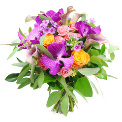 A sumptuous bouquet is showcased against a clean white backdrop, every element working together like a carefully orchestrated gathering of colours and textures. The most commanding feature is a cluster of vivid Vanda orchids in intense purple, their broad, winged petals patterned with intricate speckles that lend an unmistakably exotic character. Around them, fully formed orange roses glow like little suns, their petals tightly layered, creating a bright, celebratory contrast to the cooler purple tones. Interwoven with these are pastel and blush pink garden roses, some still in bud, others half-open and softly ruffled, introducing a tender, romantic note that feels at home in a Clerkenwell loft overlooking St John Street. Rising elegantly above and between the rounder blooms, slender calla lilies curve in sophisticated arcs, their blooms washed in muted plum and lavender shades that add a refined, modern silhouette. The bouquet is cradled by an abundance of greenery: silvery-green eucalyptus trails alongside deeper, forest-toned leaves, providing a fresh, aromatic frame and visual depth. Fine sprays of lilac and lavender filler flowers, along with tiny green sprigs, dart through the arrangement, creating subtle texture that rewards a lingering gaze. At the base, the stems are gathered and tied, their cut ends neatly aligned, underscoring the hand-crafted nature of the design. The overall palette of purple, tangerine, soft pink, and rich green feels joyful yet composed, making this an ideal bouquet for congratulating a colleague at a design studio near Farringdon, adding drama to a dinner party off Clerkenwell Road, or simply expressing admiration with something truly memorable and artistic.