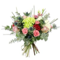 This image shows a hand-tied, florist-crafted bouquet set against a stark white background so every nuance of colour and texture reads clearly. In the middle sits a generous cluster of chartreuse-lime hydrangea, its tiny, tightly packed florets forming a plush, cloud-like centre. Scattered around that vivid core are roses in two complementary moods - deep, velvety red petals that convey intensity and a handful of soft pale pink and cream roses that open with a romantic softness. Coral-pink carnations with their crinkled, ruffled edges provide a warm, energetic counterpoint, adding layered texture and cheer.

Interwoven for contrast are blue-grey Eryngium thistles whose spiky, sculptural silhouettes introduce a modern, architectural edge and a cool, steel-blue note against the warmth of the roses and carnations. The bouquet is lushly filled with foliage: elongated silvery eucalyptus leaves that cascade and scent the composition, and upright blades of bright green filler grass that lend height and a light, airy outline. The stems are hand-gathered and tied with a natural-coloured twine, revealing fresh-cut green ends and the handiwork of the arranger.

As a Clerkenwell florist I picture this tied up and heading out for local delivery around Farringdon and Leather Lane, or sitting bright on a dining table near Spa Fields. It reads as both contemporary and affectionate - suitable for birthdays, anniversaries, or as a thoughtful get-well gesture - the blend of colours and textures promising freshness and considered design from Clerkenwell Flowers.