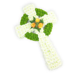 Presented on a bright white field and photographed from slightly above, this floral Celtic cross is an exercise in careful contrast and tactile detail. The primary structure consists of tightly clustered white spray chrysanthemums, their small, pillowy heads forming the broad arms and long base with a softness that suggests purity and gentle consolation. Accenting that white canvas are sections of crisp apple-green button chrysanthemums, arranged to define the classic circular ring at the intersection of the arms and to create alternating green bands along the horizontal span; the green buttons add a lively textural counterpoint to the airy whites. At the exact centre of the cross, three rich orange roses-honeyed, almost sunset-bright-offer a warm focal point, their fuller blooms curling outward and drawing the eye inward. Subtle dark-green fern sprigs cradle these roses, adding depth and a whisper of woodland scent to the visual scene. Soft studio lighting brings out the satin on the rose petals and the matte fluff of the chrysanthemum clusters, while the immaculate white backdrop keeps the design dignified and uncluttered. As a Clerkenwell-based florist familiar with commissions from St John's Square to Leather Lane, I recognise this arrangement as a choice sympathy tribute or funeral cross that quietly honours Celtic heritage; the white, green and orange palette can feel like a tender nod to Irish roots without overstating the symbolism. Clerkenwell Flowers prepares pieces like this for local memorials and wakes, balancing tradition with contemporary clarity in every stem.