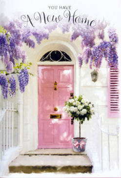 This image captures a serene Clerkenwell entryway bathed in gentle, filtered light, where every detail seems composed to honour the emotion of moving into a new home. A softly painted pink front door acts as the heart of the composition, its muted tone reminiscent of the subtle colours you might notice on early evening walks around Clerkenwell Green or along the lanes leading to Farringdon. Above it, generous trails of lavender wisteria cascade down in loose, fragrant garlands, each cluster of bloom suggesting texture you can almost reach out and feel, from the satin-smooth petals to the slightly tangled vines. The walls on either side are whitewashed and calm, with a pastel shutter standing just ajar, inviting sunlight to play across the façade in pale, dancing shadows. At the doorstep, set squarely on a worn stone slab, a grey metal bucket is filled to overflowing with lush white and cream roses, their petals unfurling in layered curls. Here and there, soft green foliage threads between the blossoms, offering a fresh, garden-cut look, as though they were gathered that morning from a courtyard off St John Street. A pink ribbon envelopes the base of the bucket, tied with an easy elegance that mirrors the understated style many Clerkenwell residents love. The atmosphere is one of quiet celebration and gentle optimism, ideal for a housewarming gesture or a congratulations bouquet delivered by a local florist. It suggests the delicate thrill of crossing a threshold that is finally, unmistakably, your own, greeted by flowers that whisper, rather than shout, "welcome home."