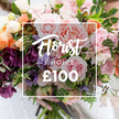 A close, slightly elevated portrait of a hand-tied bouquet that reads like a memory of an English garden at dawn. Soft pastel pink garden roses dominate the composition with their velvety, ruffled petals, giving the bouquet a peony-like fullness; around them float delicate, almost striped pale purple-and-white sweet peas and frilly spray dianthus, while peach and coral ranunculus add warm, layered centers that glow against creamy white accent flowers. Deep plum to burgundy hellebore-like blooms are tucked through the lower quarters, their textured faces providing a dramatic counterpoint that deepens the palette and creates a sense of shadow and romance. Lush, varied greenery - slender vines, eucalyptus-like rounding leaves and broader, glossy foliage - weaves through the flowers, adding cool scent and a garden-style, organic silhouette. The lighting is soft and diffuse, capturing the subtle sheen on each petal and suggesting the calm of morning market light near Exmouth Market or St John's Square in Clerkenwell. A faint white sleeve and a pair of hands cradle the stems gently at the base, and the background is artfully blurred so the rich, tactile details stay front and centre. Centrally superimposed is a slim white rectangular frame with flowing script that reads Florist's Choice and, in bold numerals beneath, ?100, clearly showing the florist-selected offering and price point. The overall impression is quietly luxurious and handcrafted - a bouquet meant for birthdays, anniversaries, or a tender 'thinking of you' - one that promises fragrance, texture and the thoughtful expertise of a local florist delivering fresh seasonal blooms across Clerkenwell and nearby Farringdon.