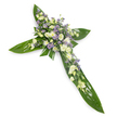 A solemn, elegant floral cross photographed against a clean white background and seen from a slight overhead angle so every detail reads clearly. The structural base is formed from large, glossy tropical leaves, their deep green surfaces and visible veins arranged with precision to outline the vertical and horizontal arms of the Christian cross. At the intersection and stretching outward along each arm sits a generous, textured spray of fresh blooms in a restrained palette of soft white, creamy ivory and pale lavender. Creamy lisianthus with ruffled, layered petals and gently closed buds create a tender, heart-like centre, while small, rounded white chrysanthemums or miniature roses punctuate the composition with concentrated brightness. Delicate sprays of tiny lavender-hued asters or limonium thread through the clusters, giving a whisper of colour and a feeling of depth against the broad green leaves. Fine, feathery filler foliage peeks between flowers, softening the edges and adding a natural, restrained air. The lighting is even and soft, lending a peaceful, almost reverent glow that reinforces the arrangement's purpose as a sympathy or memorial tribute for a funeral, wake, or graveside service. Texturally the piece balances the smooth, waxy leaves with the feathery, ruffled petals to convey both strength and tenderness. As a seasoned local florist familiar with Clerkenwell's quiet corners around Exmouth Market and St John's Square, I would choose this cross to express calm respect, conveying hope and a respectful, comforting stillness for those who gather to remember a loved one.
