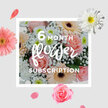 This arrangement looks like a captured sunrise in flower form, its pastel colours and gentle textures creating an atmosphere of soft light and quiet joy that would feel at home anywhere from a design studio near Farringdon to a cosy flat by Exmouth Market. Blush pink roses sit nestled at the centre, their petals unfolding in velvety layers that curl and swirl like porcelain. They are surrounded by creamy peach and blush gerberas, each bloom a perfect circle of smooth, satiny petals that radiate in neat, even spokes, adding a sense of order and cheerful openness to the design. Between these larger blossoms, cloud-white gypsophila threads itself delicately, tiny star-like flowers appearing on fine, branching stems, giving the entire bouquet a weightless, almost floating quality. White chrysanthemums complete the composition, their densely packed petals and rounded forms introducing crisp texture and a cool, refreshing brightness. The colour palette remains firmly in the realm of soft pastels-rosy blush, gentle peach, bright white-evoking the gentle warmth of dawn before the city fully wakes. In my mind, I can sense the light fragrance of roses mingling with the freshness of cut stems and foliage, the bouquet inviting you to lean in and linger. This design feels perfect for expressing enduring affection, offering comfort, or simply brightening an ordinary week, especially when it arrives regularly as part of a subscription service. Crafted with the thoughtful eye of local Clerkenwell florists, it promises that each monthly delivery will bring a similar sense of renewal, a quiet reminder that beauty can be woven into the everyday rhythm of London life.