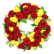 A classic circular funeral wreath is captured here against a pure white background, the clean setting allowing its rich red and yellow tones to take centre stage, much like it might appear on an easel in a Clerkenwell memorial service room. The wreath forms a complete ring with a hollow centre, densely covered so that almost no base is visible, only flowers and foliage woven tightly together. Deep red roses provide the main structure: their full, velvety blooms are carefully spaced so that each head has room to open, showing spirals of petals that darken slightly towards the core, adding a gentle sense of depth and solemnity. Between these roses, soft mounds of yellow chrysanthemums provide contrast and lightness, their many slender petals giving the arrangement a feathery, almost cushion-like texture. The interplay of the warm, sunny yellow with the intense red suggests both heartfelt sorrow and gratitude for shared memories. Supporting this blend is a foundation of fresh greenery, with glossy, mid-green leaves and touches of paler, slightly silvery foliage that hint at eucalyptus or similar varieties. These leaves peek around the blooms, softening the outline of the wreath and contributing a natural, garden-inspired feel reminiscent of the green spaces around Clerkenwell, from local churchyards to nearby parks. Bright, even lighting ensures that the colours appear vivid and the textures of each petal and leaf are clearly defined, while the white backdrop keeps the focus firmly on the floral tribute itself. The overall impression is one of care, dignity, and quiet beauty, suitable for funerals, graveside tributes, or commemorative gatherings.