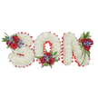 A deeply poignant, three-dimensional funeral tribute spells the word SON in bold capital letters, laid out horizontally against a clean white backdrop. Each letter is lovingly formed from a dense, cloud-like mass of small, pristine white chrysanthemums - their tiny petals packed so closely they create a soft, pillowy texture that reads as quiet purity from a distance and delicate detail up close. A bright red satin ribbon frames each character with a scalloped, pleated edge that catches light and crisply defines the curves and angles of the S, O and N; the ribbon's sheen gives the composition a formal, traditional outline against the white flowerfield. Three tasteful accent clusters break the white surface: on the top-left curve of the S, at the bottom-centre of the O, and on the top-right of the N. Each cluster features velvety deep red roses, upright spikes of blue-purple liatris or similar flowers, and rich dark green foliage including soft fern fronds and trailing leaves that lend movement and depth. The scent is gentle yet distinct - the muted, powdery sweetness of chrysanthemum beneath the warm, velveteen perfume of red roses - and the overall effect is one of solemn affection and careful workmanship. In Clerkenwell this style is often chosen for funerals, wakes or graveside services at local churchyards or memorial spaces such as nearby Bunhill Fields or chapel halls off Exmouth Market, where personalised lettering gives comfort and focus to mourners. The arrangement reads as a quiet testament to love and remembrance, combining classic sympathy colours and expert craftsmanship to honour the memory of a much-loved son.