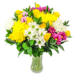 This photograph shows a joyful, full bouquet of mixed blooms standing in a clear glass vase, positioned against a pure white background that lets the colours sing. The arrangement is rounded and generously filled, with bright yellow roses and large yellow chrysanthemums forming the glowing heart of the design, their plush, tightly furled petals suggesting warmth and energy. Scattered amongst them are small white daisy-like flowers with fresh lime-green centres, adding a light, lively sparkle reminiscent of morning walks around Exmouth Market when the stalls first open. Soft white chrysanthemums echo the shape of their yellow counterparts but with an airier, cloudlike texture, softening the overall look. Vivid magenta and fuchsia chrysanthemums punctuate the bouquet with playful bursts of colour, while a few gentler pastel pink blossoms provide subtle shading and depth. The whole arrangement is framed and supported by deep green foliage, likely Ruscus or similar, with smooth, glossy, oval leaves that curve gracefully and peek through the flowers, giving the bouquet structure and a lush, natural feel. Through the clear glass vase, you can see neatly gathered stems immersed in clean water, which enhances the sense of freshness and care. The composition conveys uncomplicated happiness and quiet celebration, perfectly suited for sending a get-well wish to a flat near Clerkenwell Green, marking a small milestone, or simply brightening a dining table off Farringdon Road. It feels like a bouquet designed to bring sunshine indoors, crafted with an experienced local florist's eye for colour and balance.