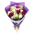 A vibrant hand-tied bouquet is photographed upright against a crisp white background, making every colour and texture feel vivid and immediate. At the centre are cream-white roses, tightly coiled and perfectly formed, their outer petals gently curling to suggest softness and subtle fragrance. Surrounding them, deep magenta and fuchsia carnations create a rich halo of ruffled petals, their layered, almost feathery texture bringing movement and depth to the design. Between these bolder blooms, delicate white alstroemeria, or Peruvian lilies, slip gracefully into view, each petal lightly marked with fine pink-red streaks and anchored by dark stamens that give a speckled, almost hand-painted effect. The flowers are framed by an abundance of fresh green foliage, some leaves solid and glossy, others softly variegated at the edges, introducing a natural contrast that enhances the brightness of the whites and magentas. The stems are neatly gathered and taper downward in a gentle cone, enclosed first by a fitted collar of clean white wrapping paper. Over this, an outer layer of translucent purple cellophane or paper is wrapped loosely, its slightly crinkled surface catching reflections like silk in the light. At the base, a vivid, iridescent green satin ribbon pulls everything together, tied in a tidy bow that feels both playful and polished. A small, rectangular light-brown gift tag dangles from the ribbon, quietly suggesting a handwritten message waiting to be read. The overall impression is one of joyful celebration and careful craftsmanship, reminiscent of a bouquet prepared by Clerkenwell Flowers for a birthday brunch on St John Street or a surprise thank-you delivered to a studio near Exmouth Market.