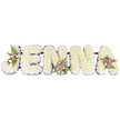 A profoundly tender memorial piece spells the name JENNA in bold, three-dimensional block letters built from a dense sea of creamy white chrysanthemums (or similar small, soft-petalled blooms) set against a clean white backdrop. Each letter reads clearly from a short distance: the chrysanthemums are packed tightly to create a cloud-like surface that catches soft morning light and suggests quiet reverence. A delicate band of purple-either a thin satin ribbon or a border of tiny lavender florets-traces the inner edges of each character, giving each letter a gentle outline and a feeling of careful definition without overwhelming the white. The tribute is punctuated by three small accent clusters: a curved spray of blush-pink and lavender spray roses tucked into the upper sweep of the J, a compact posy of pale cream and soft pink roses at the middle of the first N, and a final cluster of lavender-hued sprays with fern fronds on the A. The roses sit against fresh, feathery green fern leaves, their velvety petals and faint perfume offering a warm, human touch to the otherwise pure palette. Thin, dark structural bars lie discreetly behind the letters, linking them together and ensuring the whole composition reads as one stable piece suitable for standing at a funeral, wake, or celebration of life. The overall mood is one of respectful beauty-an arrangement designed to convey deep sympathy and enduring remembrance while remaining understated, tactile, and crafted with the skill of an experienced florist familiar with memorial floristry in Clerkenwell and nearby Chapple Street and Exmouth Market.