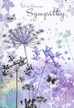 This sympathy card reads like a gentle visual poem, much like the soft, reflective atmosphere on a quiet evening stroll past Clerkenwell Green. Airy silhouettes of wildflowers, their heads forming delicate umbels, rise from the base of the card in elegant shades of lavender, indigo, and soft blue. Fine, tapering stems reach upward as if drawn toward a pale, comforting sky, while the loosely painted background shifts between washed violets and muted green-grey, reminiscent of distant trees seen through a light mist. The petals and tiny florets are suggested more than strictly defined, lending the scene a dreamlike, almost whispered quality, as though the flowers are fading into memory yet still tenderly present. Faint impressions of extra foliage drift across the card like soft shadows, enriching the sense of depth without crowding the design. Here and there, butterflies hover just above the blooms, their translucent wings symbolising transformation and quiet companionship in moments of grief. The colour palette is cool but soothing, the kind of gentle harmony we often echo in funeral flowers for local services around Farringdon and King's Cross. The words With Sincere Sympathy, or a similarly simple message, sit gracefully within this calm setting, written in an elegant, flowing script that complements the organic forms below. The overall feeling is of a respectful, unintrusive embrace: something you might send when you want your condolences to be tender but not overwhelming, allowing the recipient space to grieve while knowing they are held in thought and care.